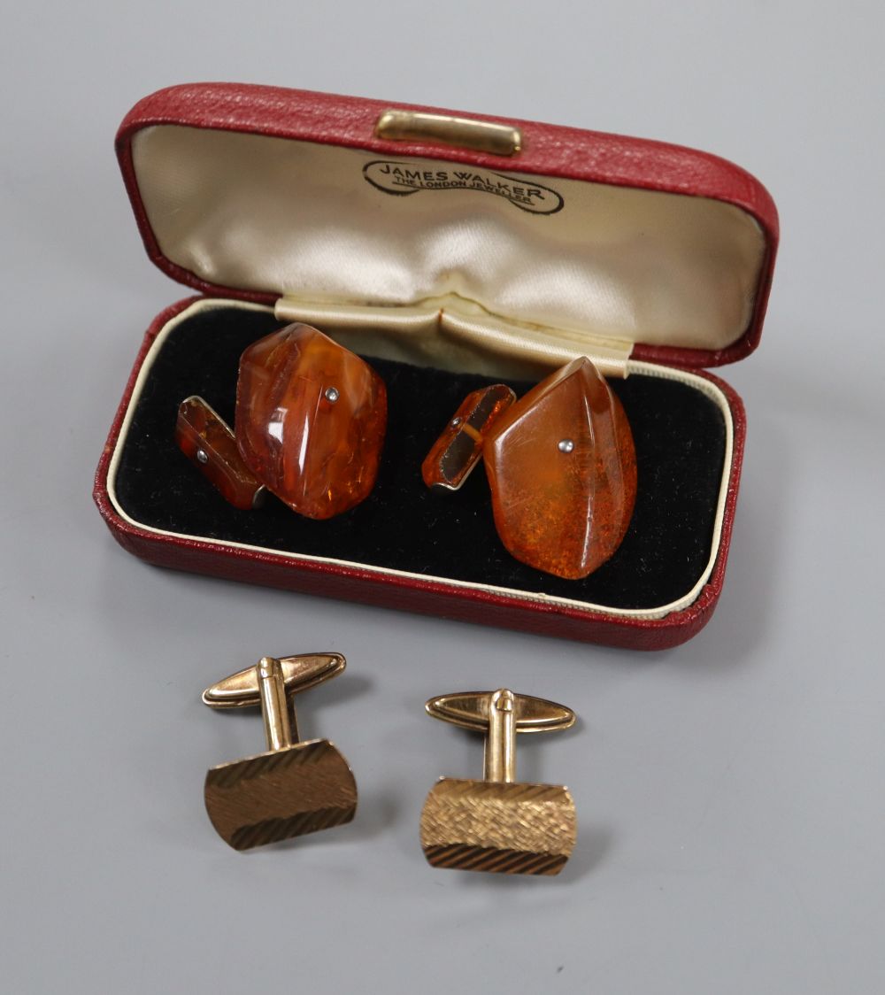 A pair of 9ct gold cufflinks, 6.1 grams and a pair of amber cufflinks.